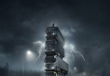 Volvo launches four new trucks, stacking them in a tower and placing the President of the company on top of them in a spectacular movie